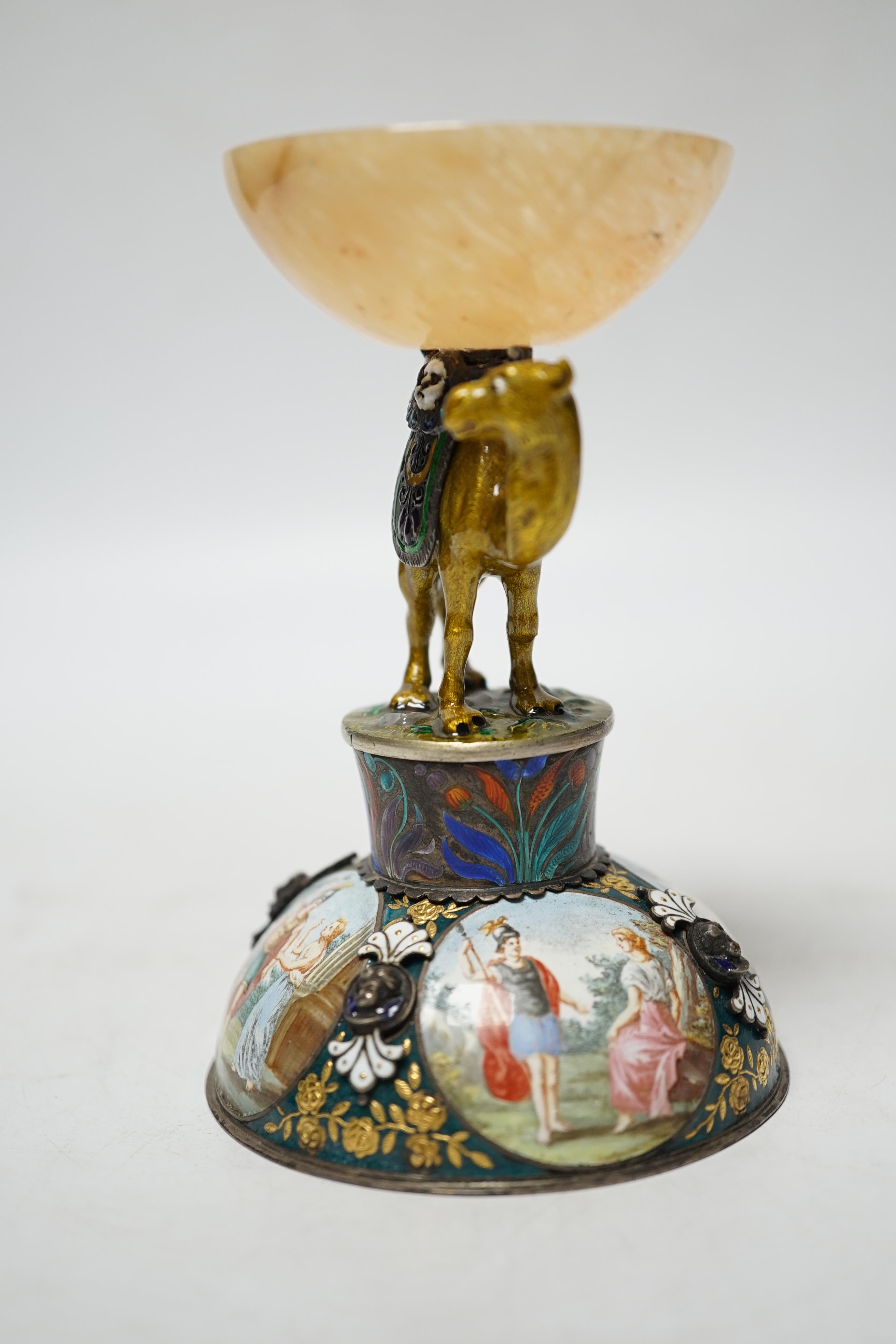 A 19th century Viennese? white metal, polychrome enamel and onyx mounted small centrepiece decorated with figural scenes, the stem in the form of a camel, height 10.7cm.